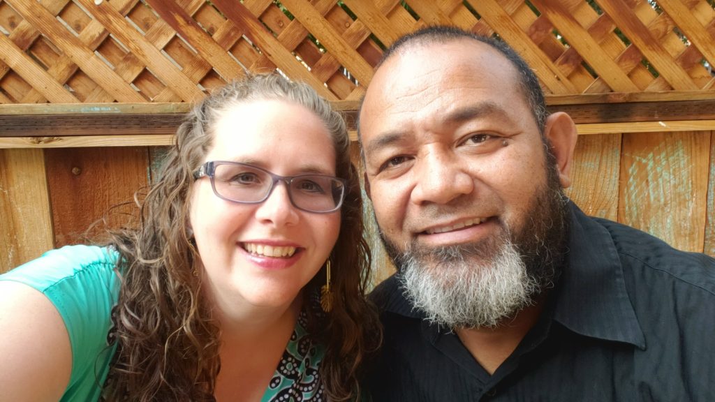 two adults smiling