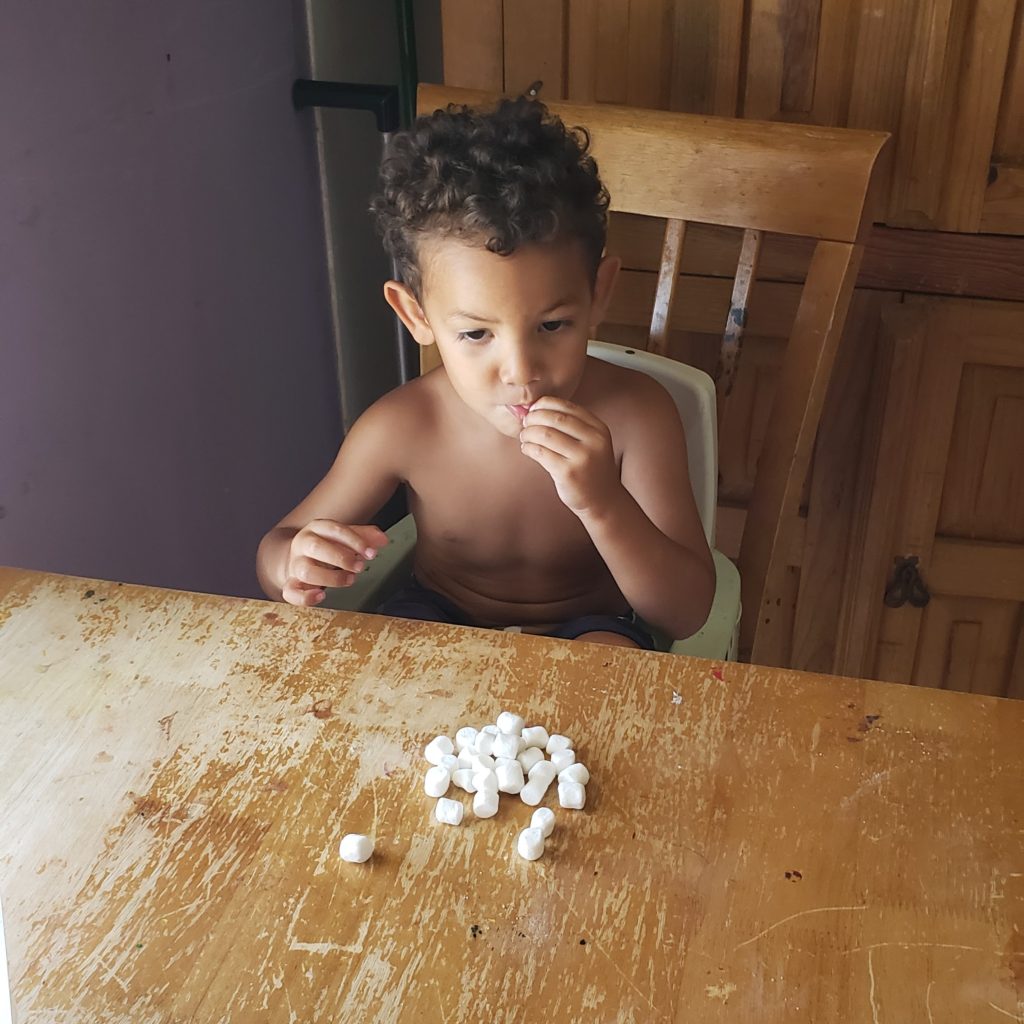 boy eating marshmallows