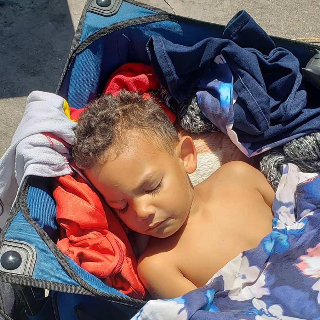 boy asleep in wagon