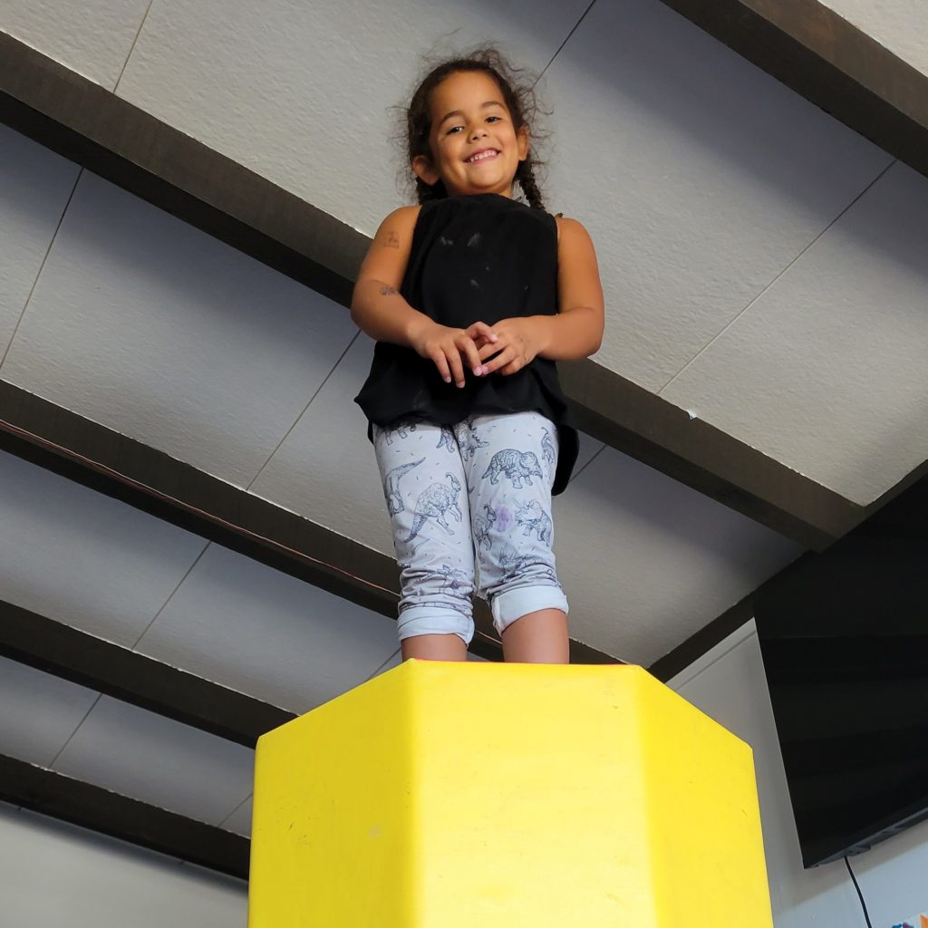 girl standing up high