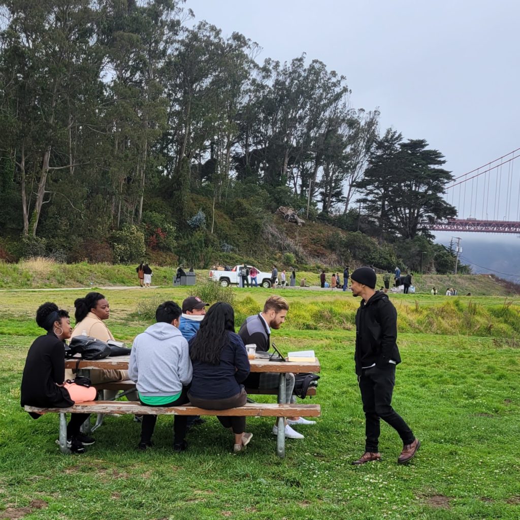 7 adults at picnic table