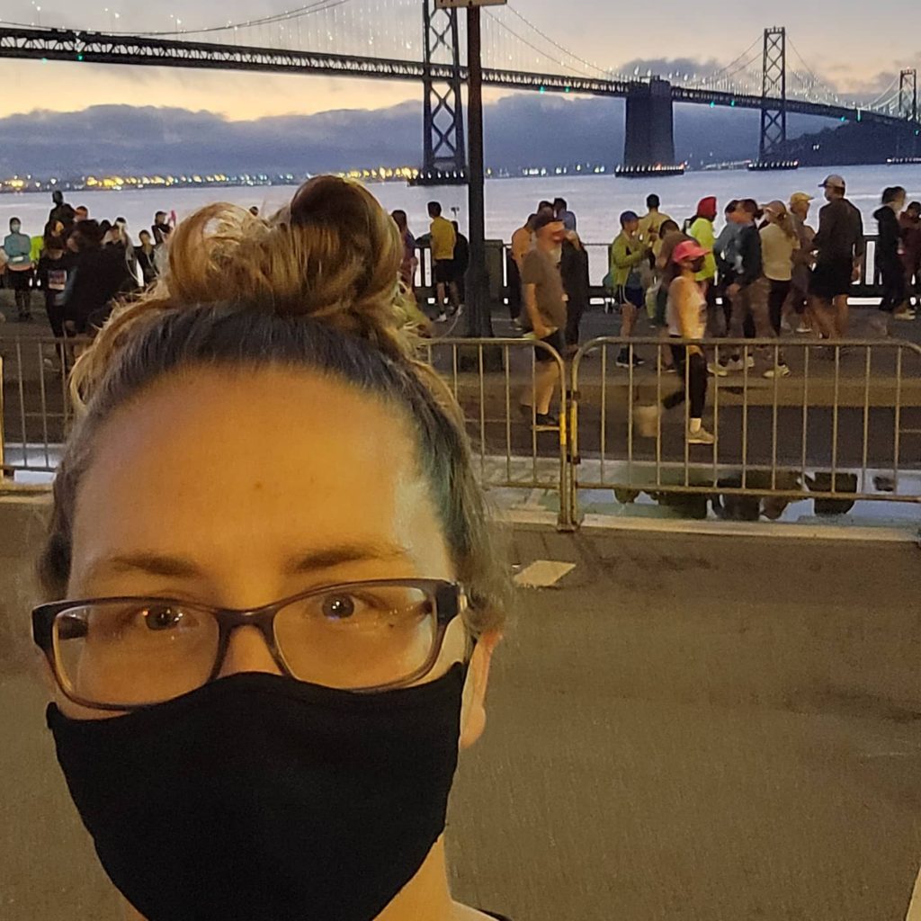 woman in front of bay bridge