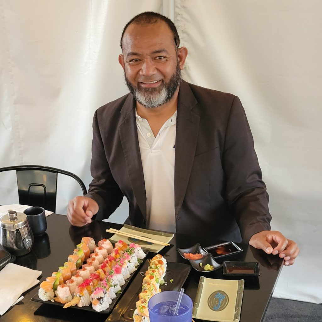 man eating Sushi