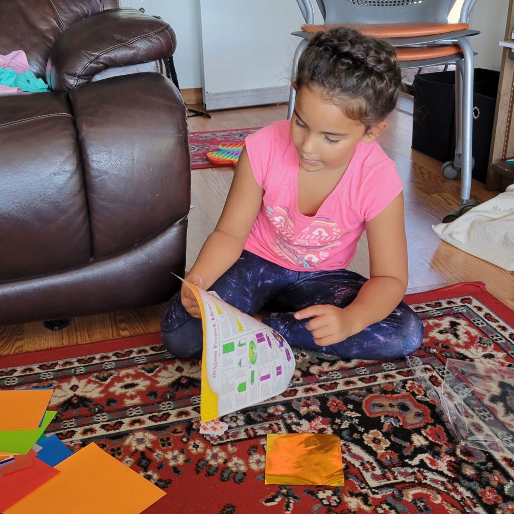 girl doing origami