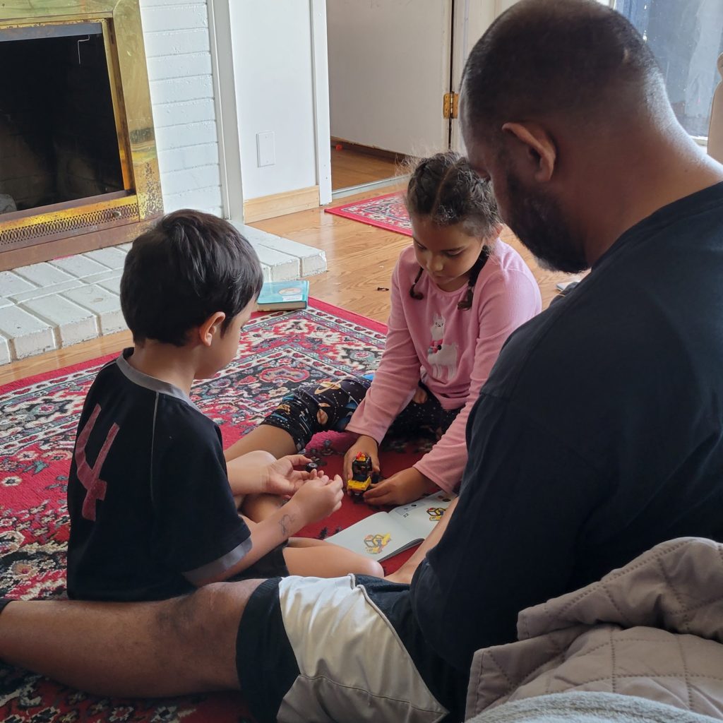 dad playing with kids