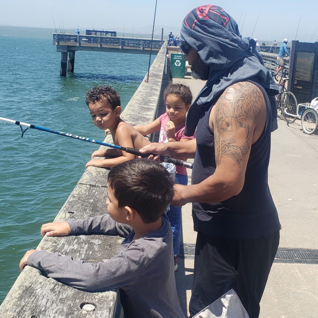 dad and kids fishing