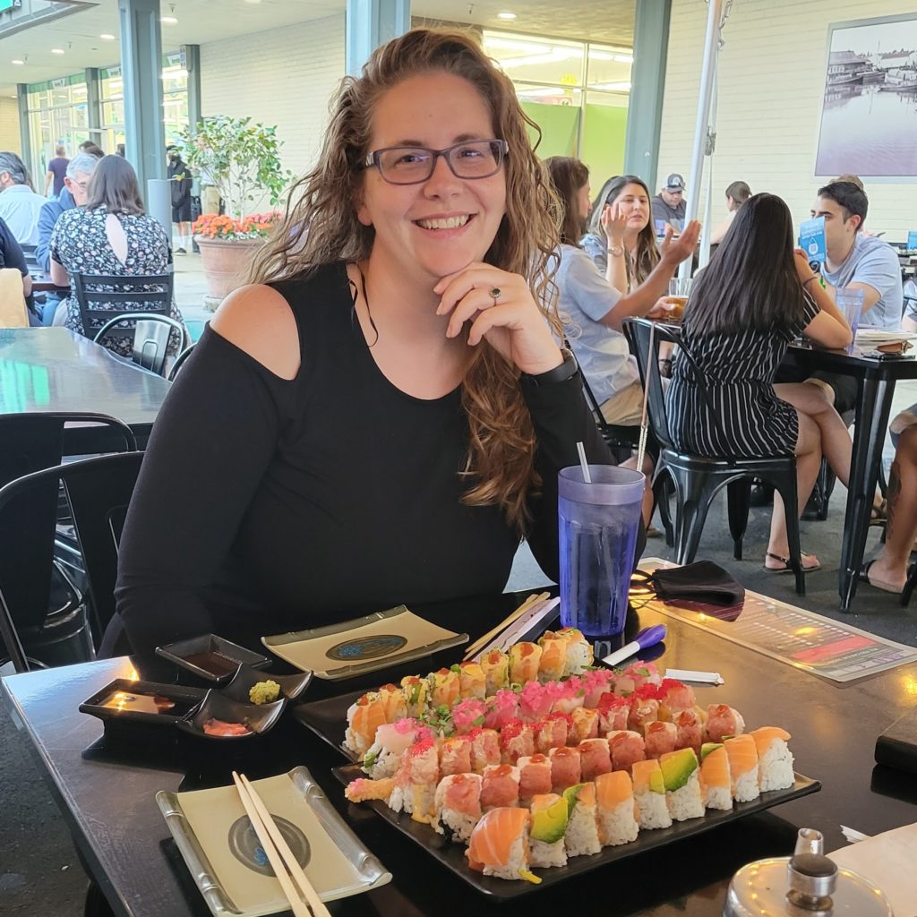 woman with large plate of sushi