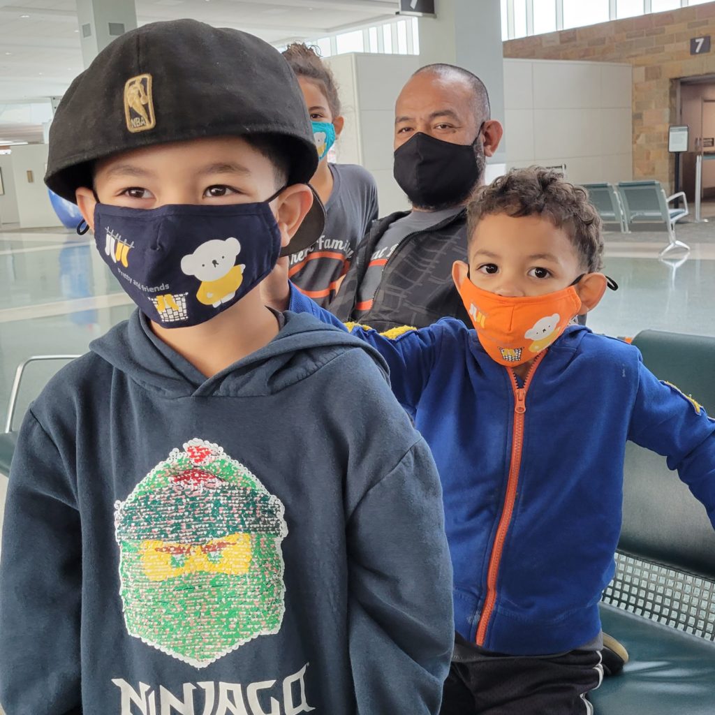 dad and four kids in masks