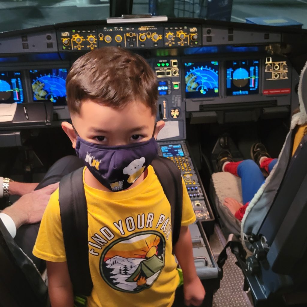 boy in cockpit