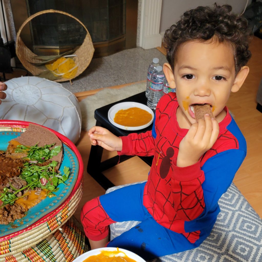 boy eating eritrean food