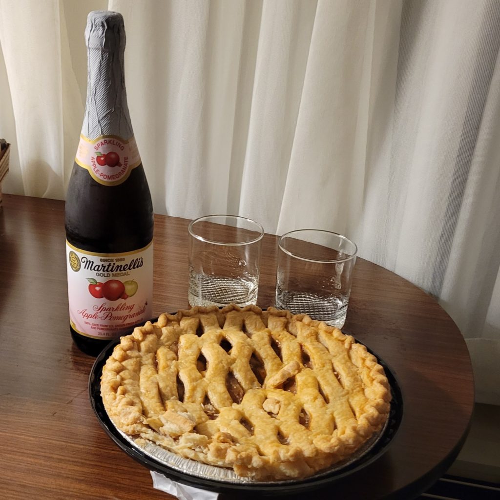 table with sparkling cider and pie
