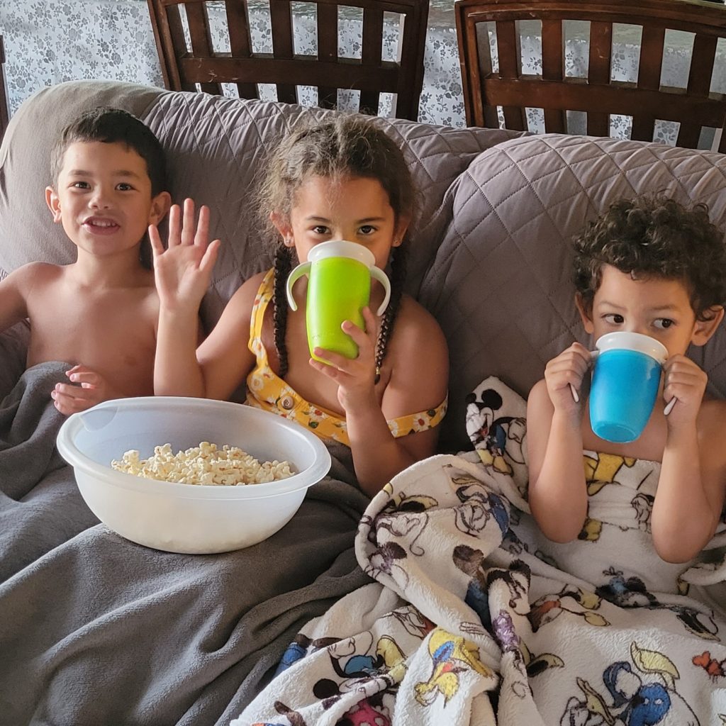 three kids on couch