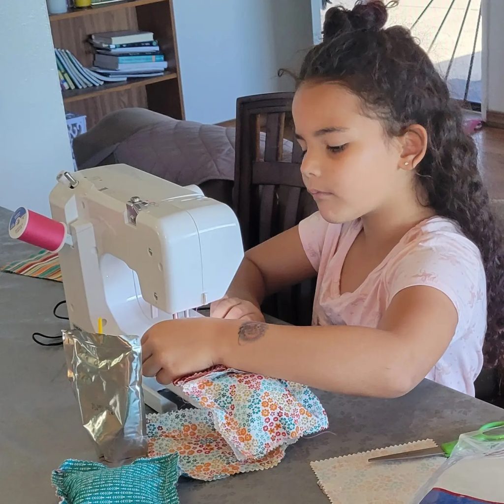 girl at sewing machine