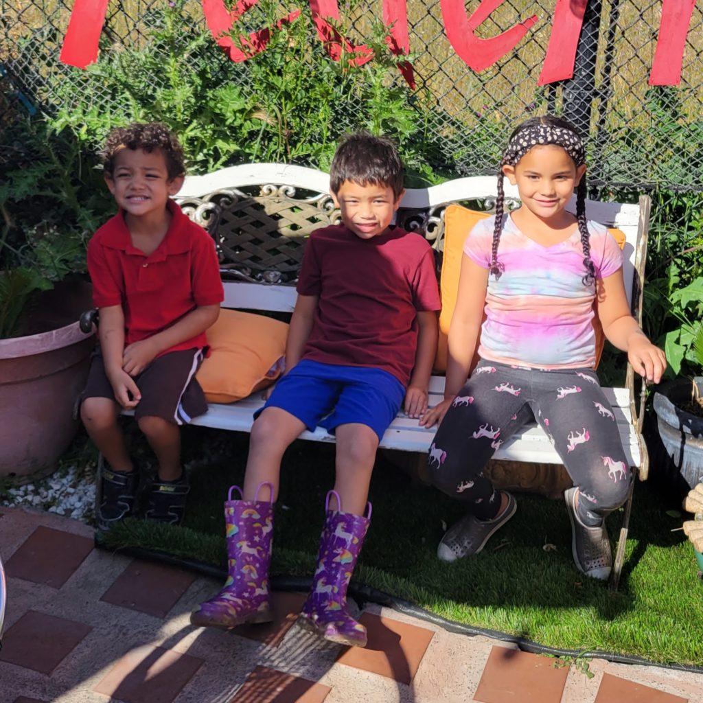 three kids on bench