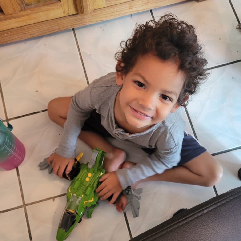 boy with toy spaceship