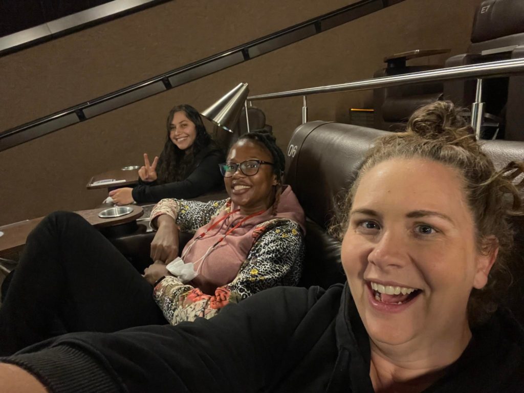 3 women in movie theater