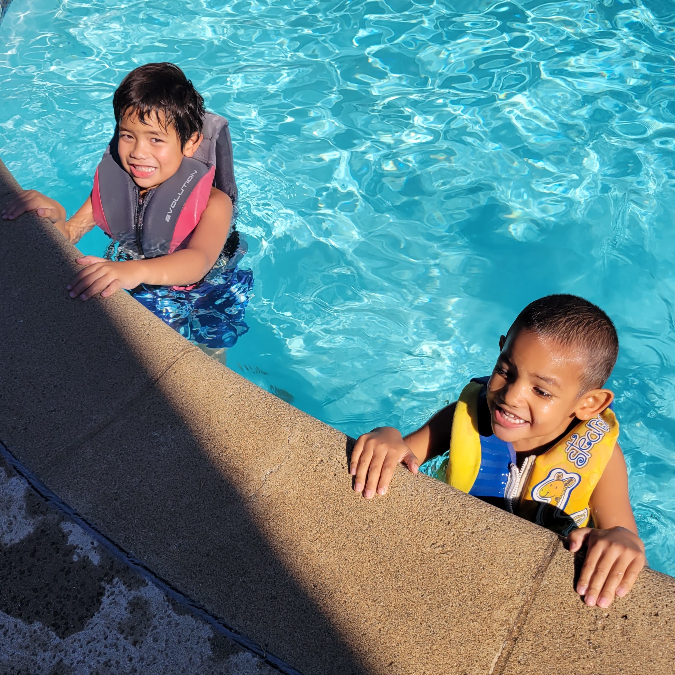 two boys in pool
