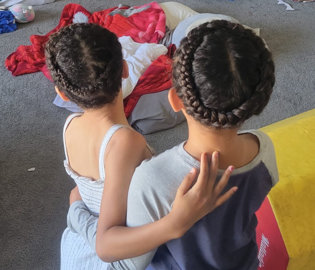 two girls with braided hair