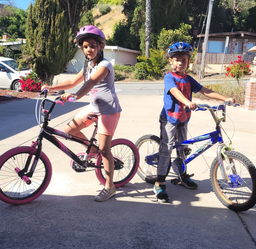 two kids on bikes